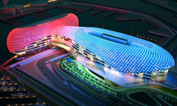 Yas Viceroy в Абу-Даби – первый в мире отель, построенный вокруг гоночной трассы Формулы-1. Его части по обе стороны дороги соединены мостом из стекла и стали; покрытие отеля – сетка со встроенной светодиодной системой. Когда гонщик финиширует, огни здания создают образ гигантского клетчатого флага. Yas Viceroy в Абу-Даби – первый в мире отель, построенный вокруг гоночной трассы Формулы-1. Его части по обе стороны дороги соединены мостом из стекла и стали; покрытие отеля – сетка со встроенной светодиодной системой. Когда гонщик финиширует, огни здания создают образ гигантского клетчатого флага.
